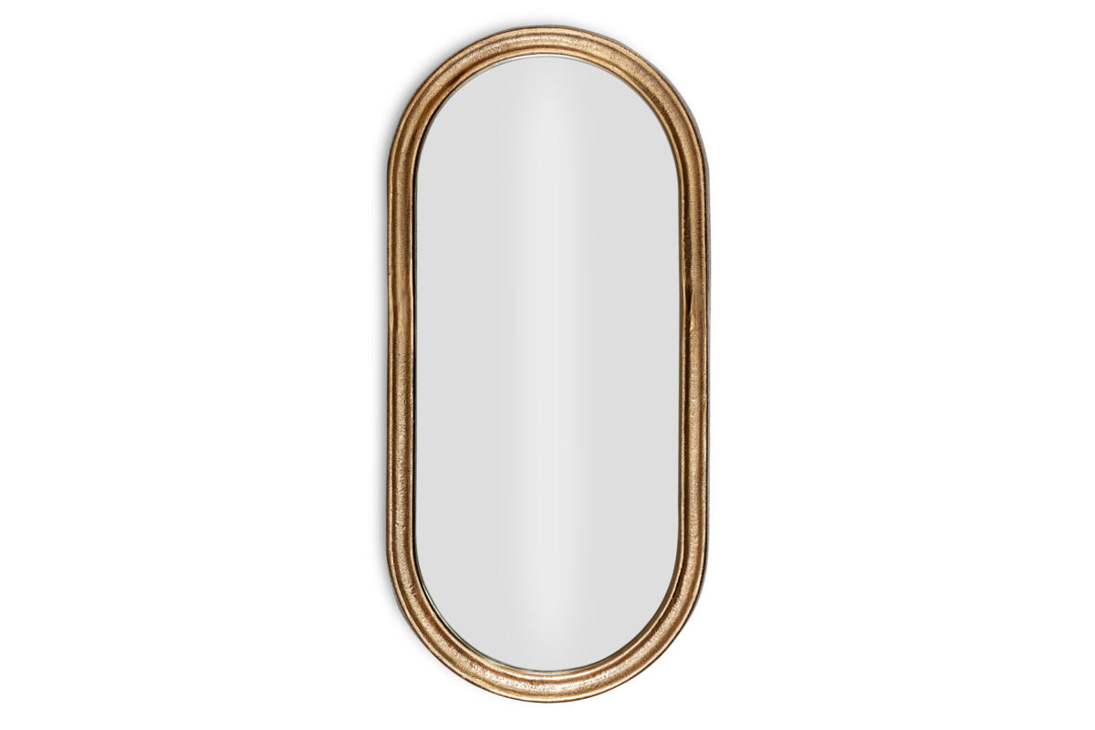 The Mbwa Oval Mirror by nkuku features a reflective surface and an antique brass, textured frame, shown against a plain white background.