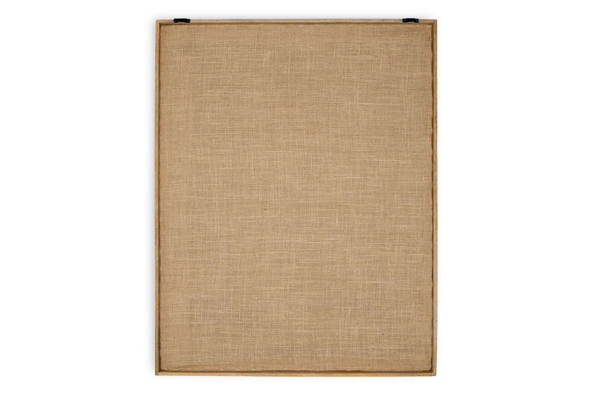 The Mauri Frayed Wall Art - Neutral by nkuku is shown from the back: a rectangular, vertically oriented canvas of coarse beige fabric tightly stretched on a wooden frame with two black hanging hardware pieces at the top. Background is white.