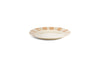 The nkuku Patthar Side Plate - Cream & Clay features a hand-painted wide rim with alternating tan and cream stripes and a plain cream center, creating an elegant ceramic addition to your table.
