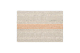 The Buna Placemats - Clay by nkuku are rectangular beige placemats with thin horizontal black lines and a wide peach stripe, offering a simple, modern look that adds minimalist style to any table setting. Set of 2.