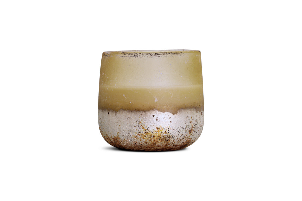 The nkuku Oakmoss & Rose 1 Wick Scented Candle features a round, textured matte cup. Its top half fades from muted yellow to beige, while the base is speckled white and brown like worn ceramic. Background: plain white.