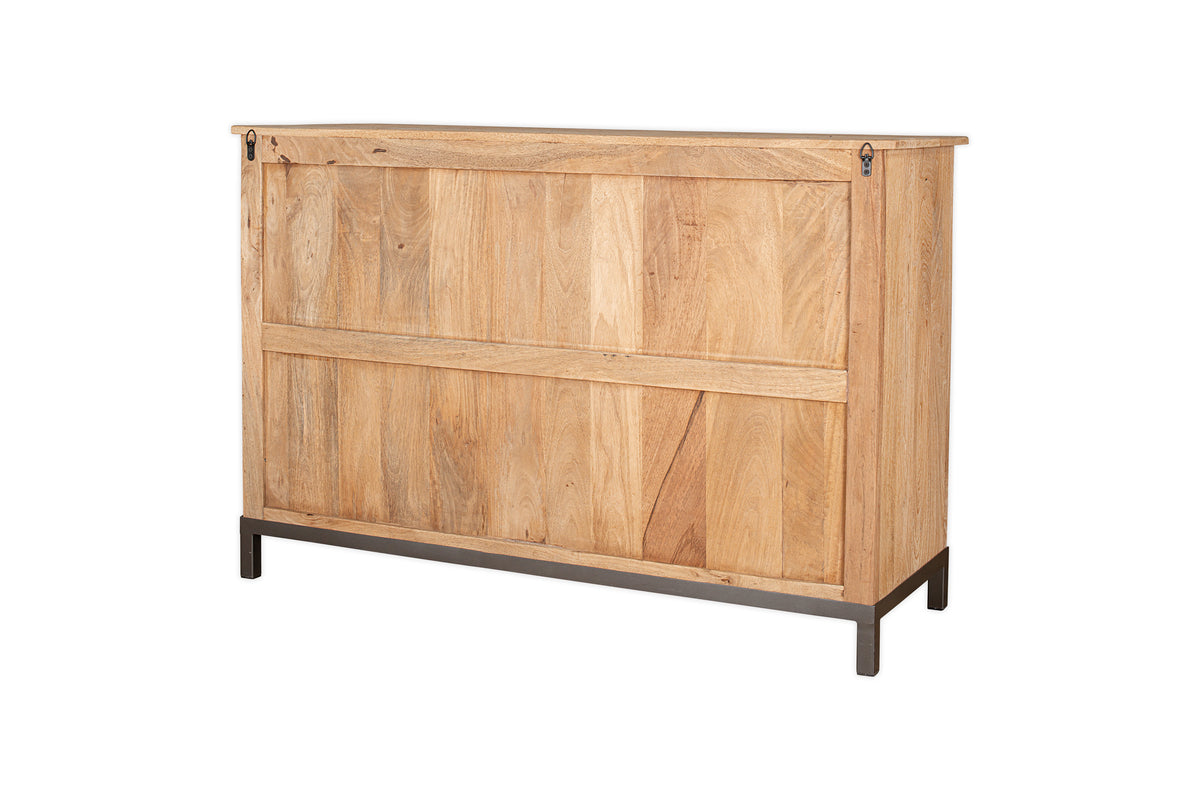 The nkuku Nirvi Mango Wood & Iron Sideboard - Black features a light natural mango wood finish, simple panel details, a flat top, and black metal legs, shown here against a white background.