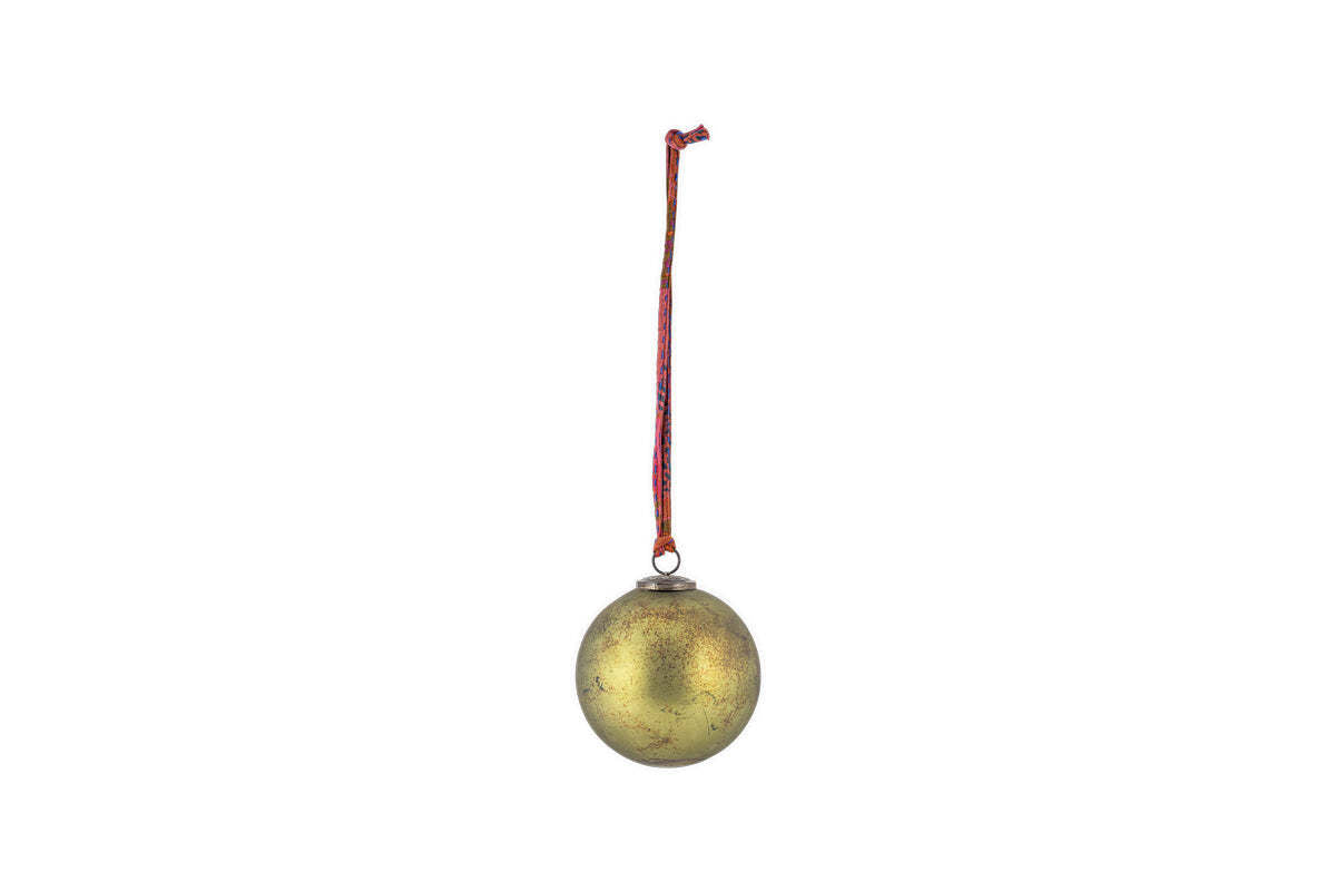 The Oko Giant Bauble - Matt Green by nkuku hangs from a red and white string against a plain white background, adding classic festive charm to your Christmas decor with its slightly worn, matt green finish.