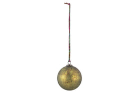 The nkuku Oko Giant Bauble in matt green features a metallic, subtly mottled finish and hangs from a colorful patterned string—an elegant accent for your festive décor against any plain white background.