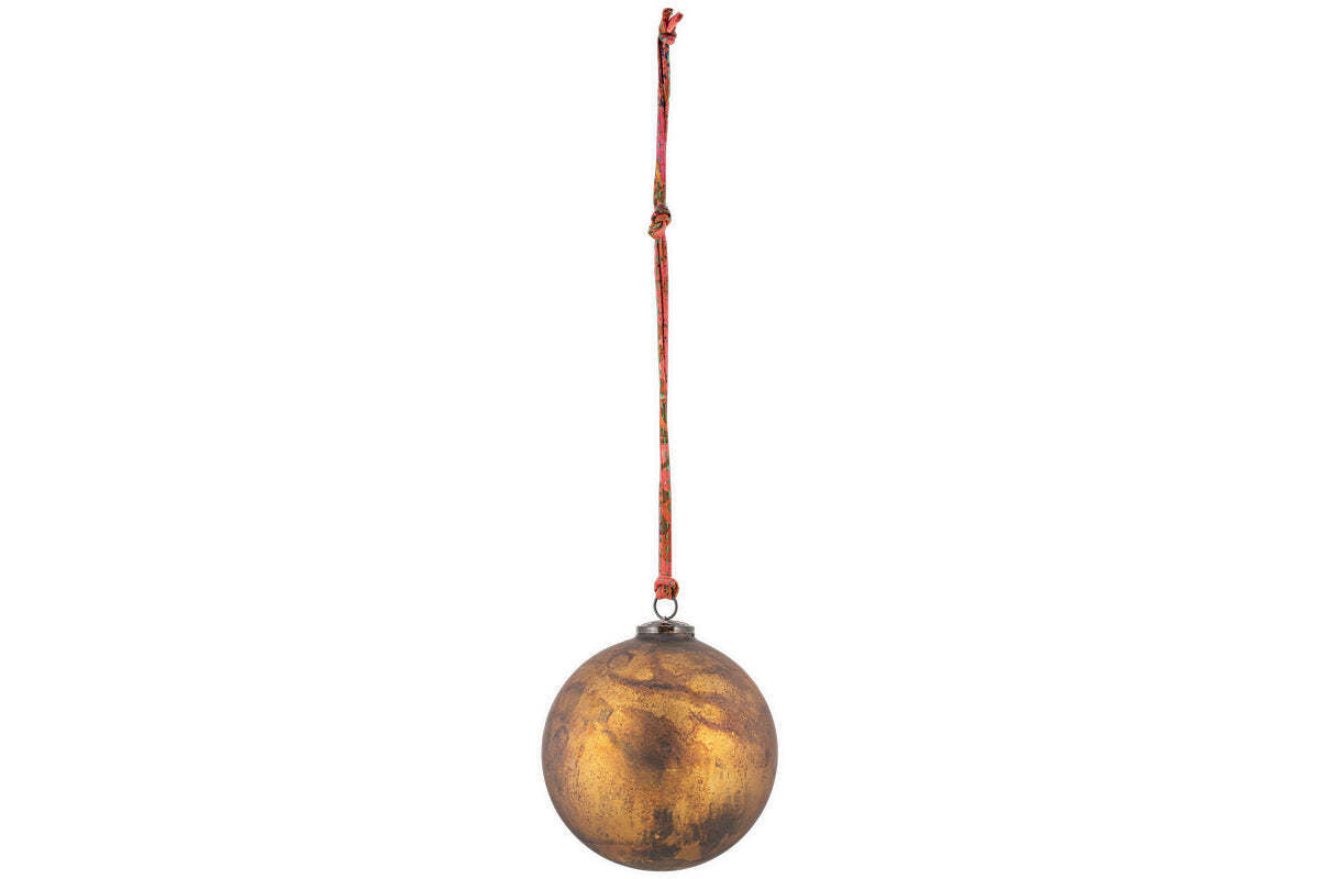 The nkuku Oko Giant Bauble in matt gold is an oversized, metallic oval ornament with a tarnished finish. It hangs from a red and orange string by a small loop, ideal for festive décor, and is shown against a plain white background.