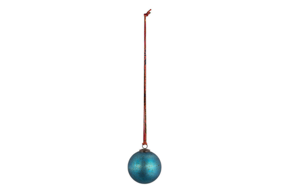 The nkuku Oko Giant Bauble in matt teal, shaped like an egg with a metallic finish, hangs from a long red ribbon against a white background—a simple yet elegant addition to any festive Christmas display.