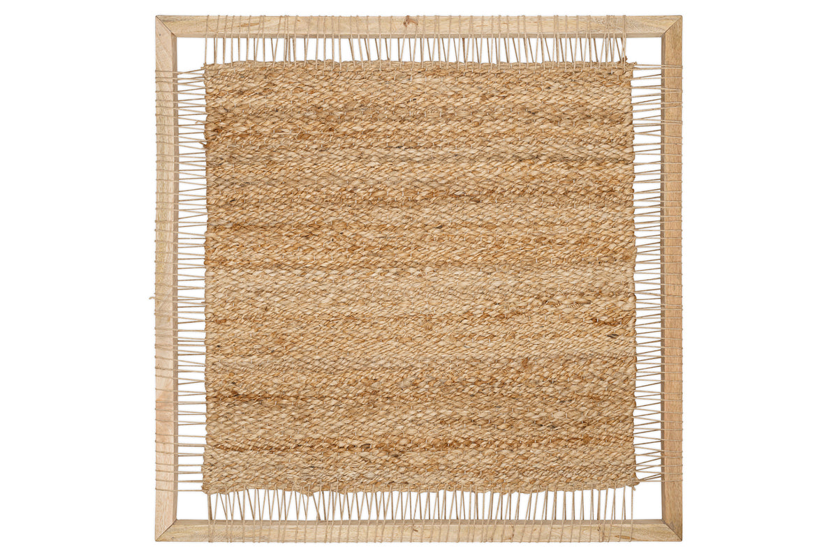 The Pemali Woven Jute Wall Art by nkuku features a rectangular natural jute mat with a rough, tan texture and uneven edges, tightly framed in light mango wood for a handloom-inspired, rustic look with visible string attachments.