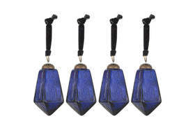 The nkuku Ratnam Baubles - Indigo - Large (Set of 4) feature geometric, faceted deep blue glass with an antique finish, textured surfaces, silver-colored caps, and black cords—bringing classic elegance to your holiday decor.