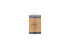 The Rustic Soy Blend Mini Pillar Candle - Charcoal by nkuku is a grey mini pillar candle with a textured finish and a brown label, shown against a white background.