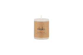 A white Rustic Soy Blend Mini Pillar Candle by nkuku, featuring a textured finish and a brown paper label, shown against a plain white background.