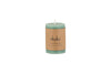 The nkuku Rustic Soy Blend Mini Pillar Candle in Sage Green features a hand poured design, brown paper label, and stands upright against a white background.