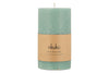 The nkuku Rustic Soy Blend Pillar Candle in Sage Green (Large) features a textured finish and a tan paper label reading: nkuku, Rustic Pillar Candle, Hand Poured, Soy Wax Blend.