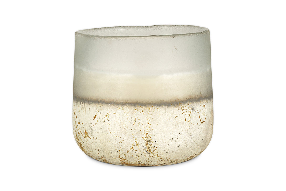 A translucent, frosted glass cup with a rounded shape and a gradient from clear to white with gold-speckled accents holds the nkuku Cardamom & Amber 3 Wick Scented Candle.