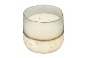 The nkuku Sea Salt & Moss 3 Wick Scented Candle comes in a round, semi-transparent glass holder with a frosted white-to-speckled gold and beige gradient and features a UK-inspired fragrance.