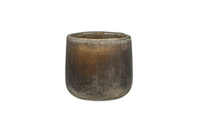 The nkuku Cedarwood & Fig 1 Wick Scented Candle is housed in a round, textured dark brown ceramic pot with a matte finish and slightly uneven rim, displayed against a white background.