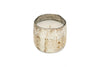 The nkuku Juniper & Fir 1 Wick Scented Candle features a white candle in a rustic, weathered white and brown textured reusable container, adding charm to any space. Shown on a white background.