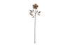 The Svara Stem Rose by nkuku is a decorative metal wall hanging featuring layered petals and leaves on a long stem, all in an antique brass finish, set against a white background.