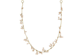 The Tanu Mango Wood Beaded Garland by nkuku features natural and brass beads spaced along a fine strand, evoking the charm of a festive garland. Elegant and nature-inspired, it adds warmth and handcrafted style to your decor.
