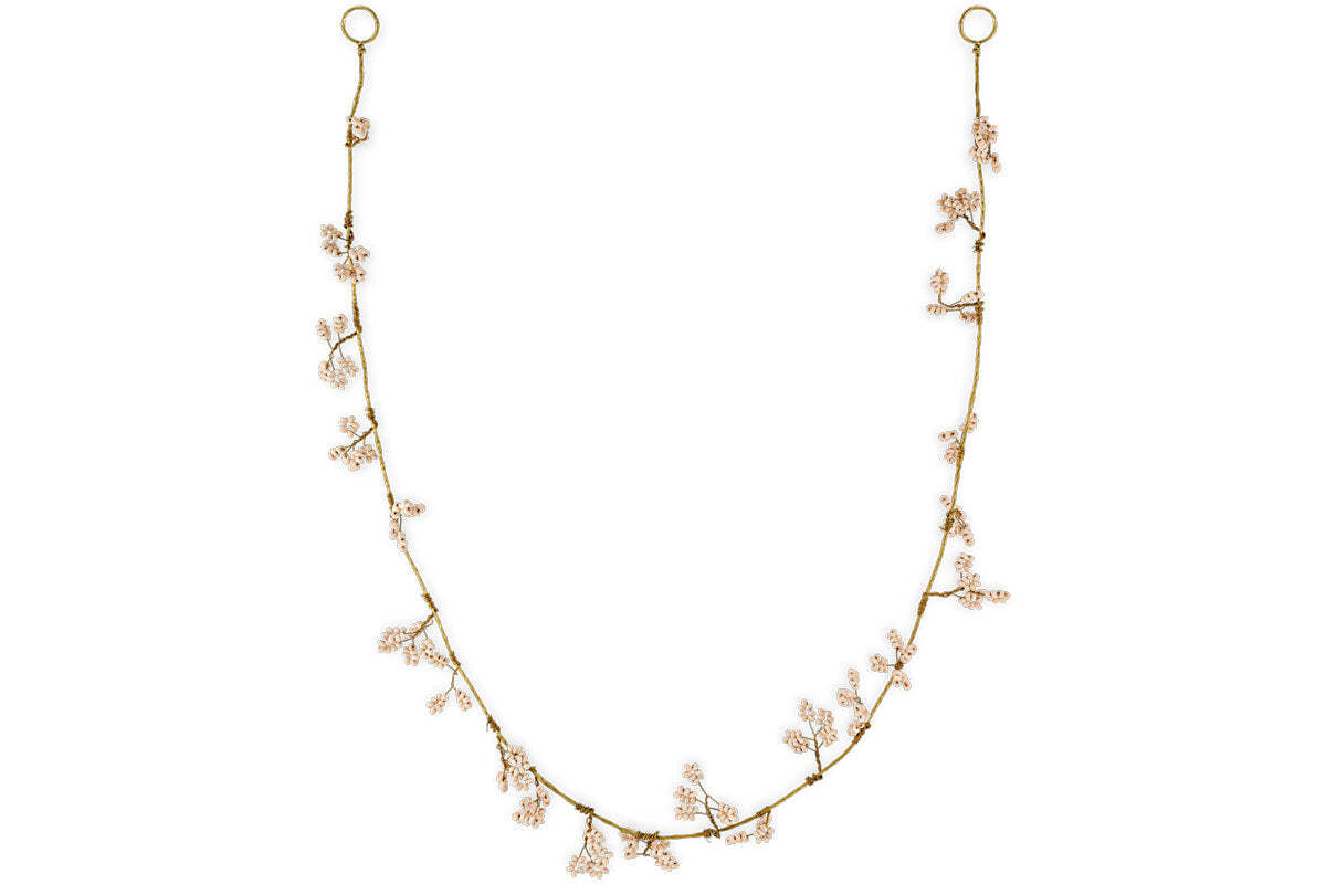 The Tanu Mango Wood Beaded Garland by nkuku features natural and brass beads spaced along a fine strand, evoking the charm of a festive garland. Elegant and nature-inspired, it adds warmth and handcrafted style to your decor.