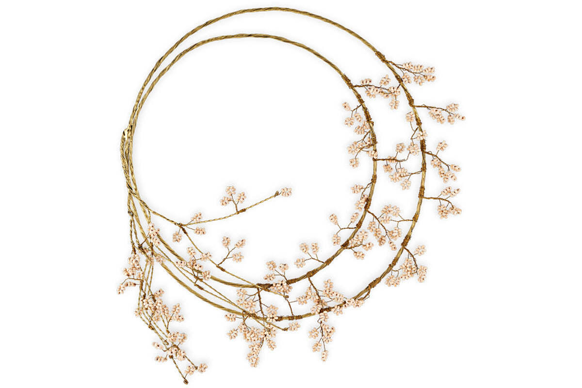 The nkuku Tanu Layered Mango Wood Beaded Wreath features natural wood and brass beads in a layered design, creating an elegant, minimalist look—ideal for festive decorating against a crisp white background.