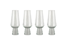 A set of four nkuku Visla Champagne Flutes in clear, hand-blown glass with wide, sturdy bases is arranged in a row on a white background.