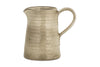 The Valinha Earthenware Jug - Grey - Small by nkuku features a handle, spout, and subtly textured surface with a rounded shape. This rustic tableware piece adds unique charm to your dining experience.