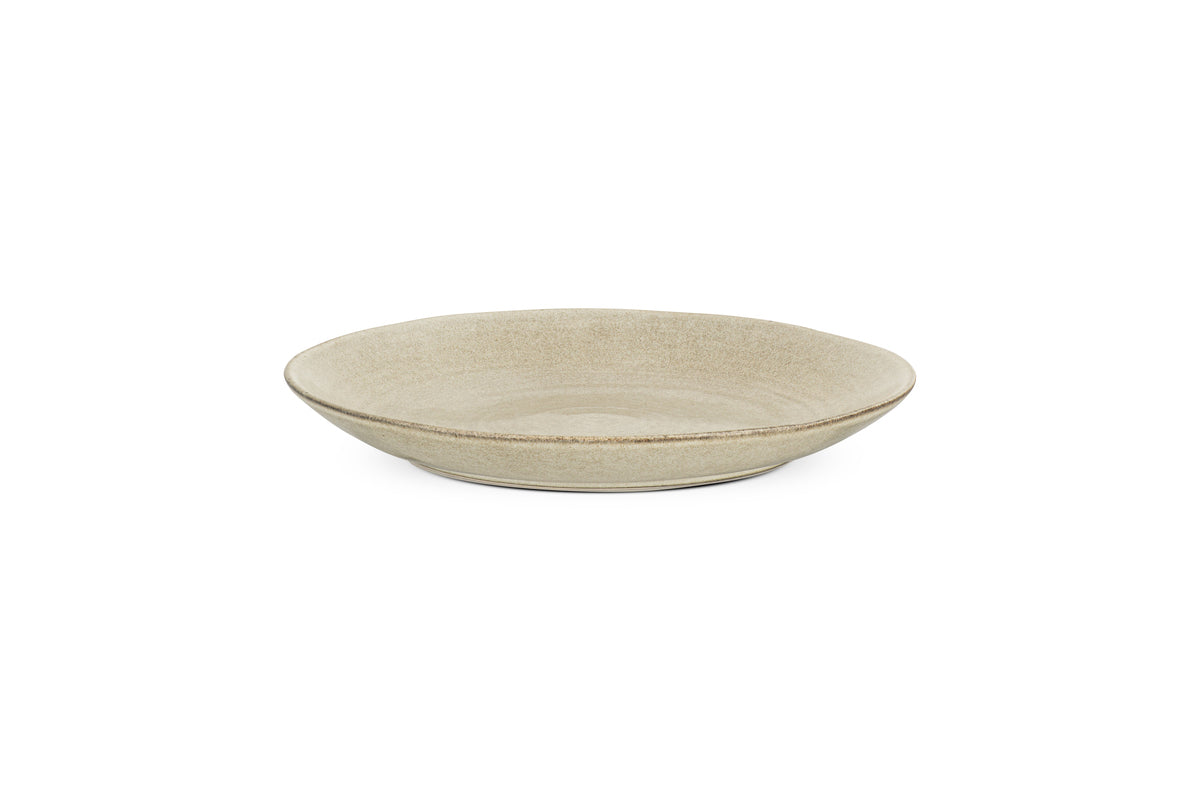 The Valinha Earthenware Dinner Plate by nkuku features a round, grey ceramic design with a subtle reactive glaze and smooth texture, elegantly showcased against a white background—an ideal addition to any tableware collection.
