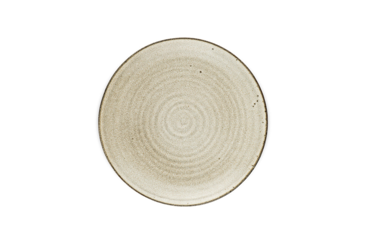 The Valinha Earthenware Side Plate by nkuku features a round, grey ceramic design with a textured spiral pattern and a slightly darker rim, viewed from above on a white background—a subtly elegant tableware piece.
