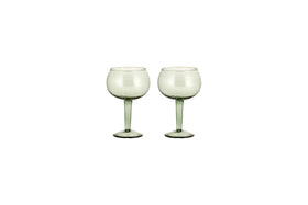 The nkuku Yala Hammered Gin Glass set includes two sage green glasses with long stems, displayed side by side on a white background.