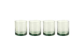 The nkuku Yala Hammered Tumbler - Sage Green (Set of 4) features clear, textured recycled glass tumblers with a subtle sage green tint at the base, shown side by side on a white background.