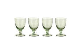 Four sage green Yala Hammered Wine Glasses by nkuku are arranged in a row on a white background. Set of 4.
