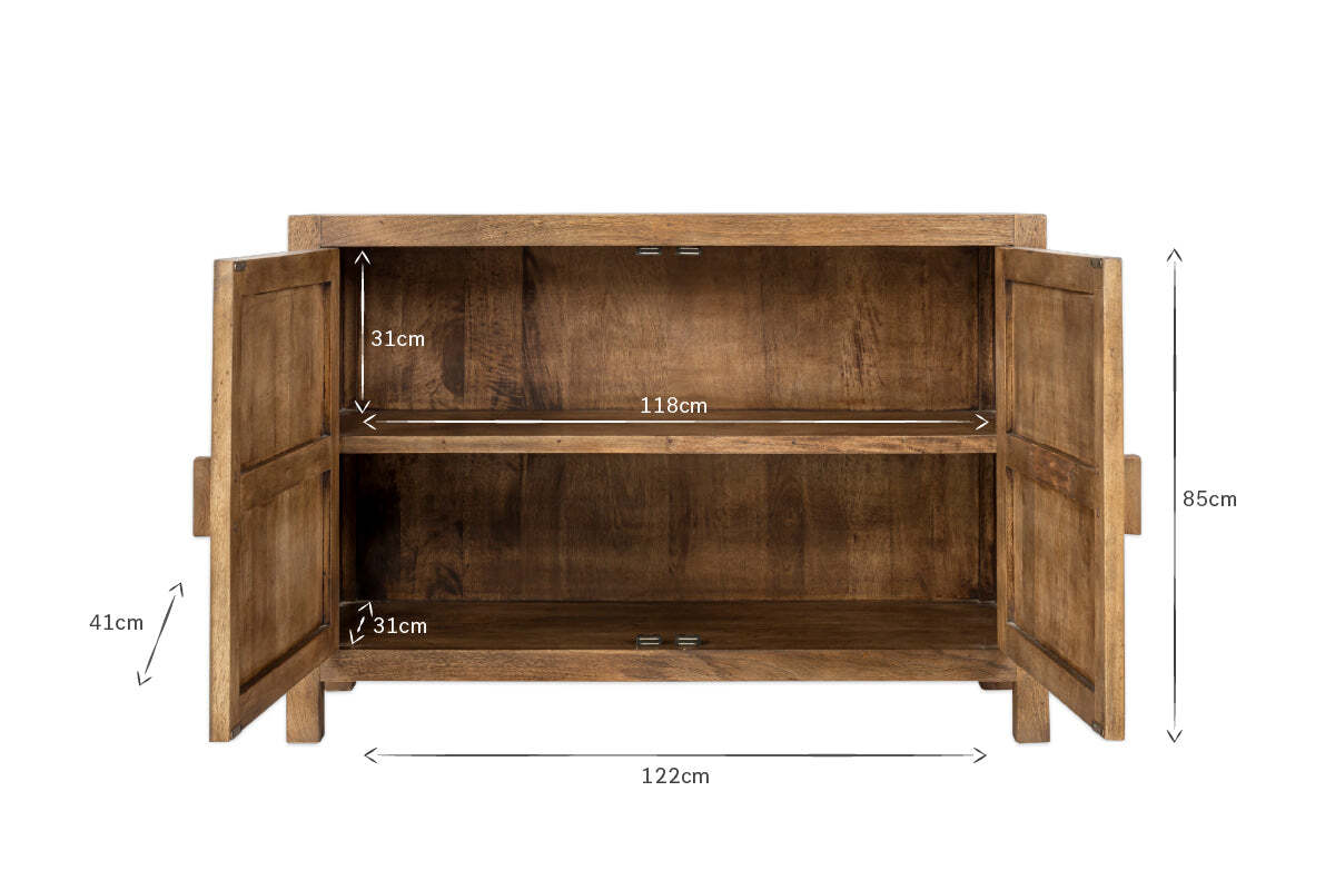 The nkuku Yasha Reeded Mango Wood Sideboard features two open doors revealing two shelves. It measures 85cm high x 122cm wide with 118cm wide shelves (31cm and 41cm high). Crafted from natural finish mango wood.