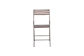 A front-facing nkuku Yealme Iron Bistro Chair with a dark brown finish features horizontal slats on the seat and backrest, slim sturdy legs with hinges and support bars, evoking classic industrial outdoor style. The background is plain white.