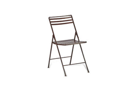 The nkuku Yealme Iron Bistro Chair is shown angled right on a white background. With a simple brown slatted seat and backrest plus thin legs, its lightweight minimalist design suits industrial outdoor settings.